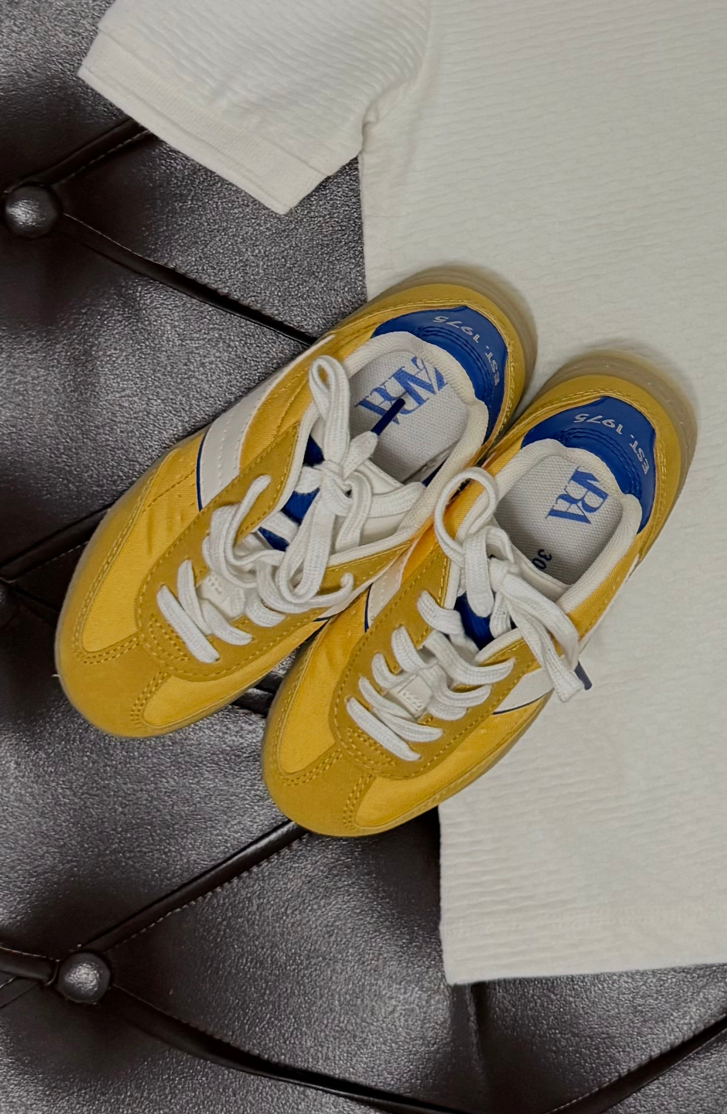 Ribbed Cream Tee + Mustard Shorts + Zara Yellow/Blue Sneakers